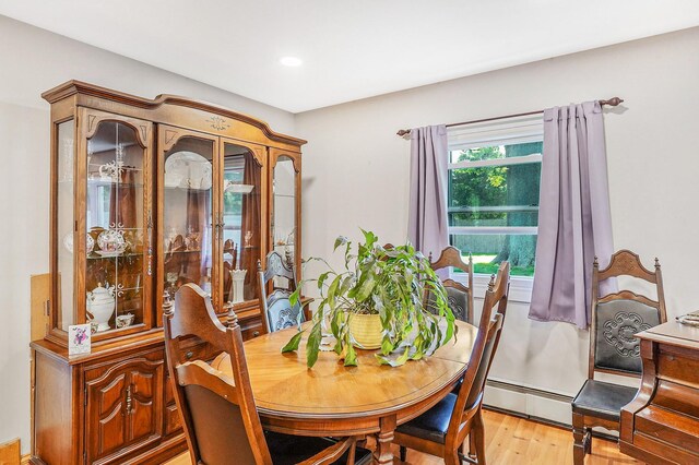 1340 Stony Brook Rd, Stony Brook, NY 11790 - dining room with a baseboard heating unit, light wood-style flooring, and recessed lighting