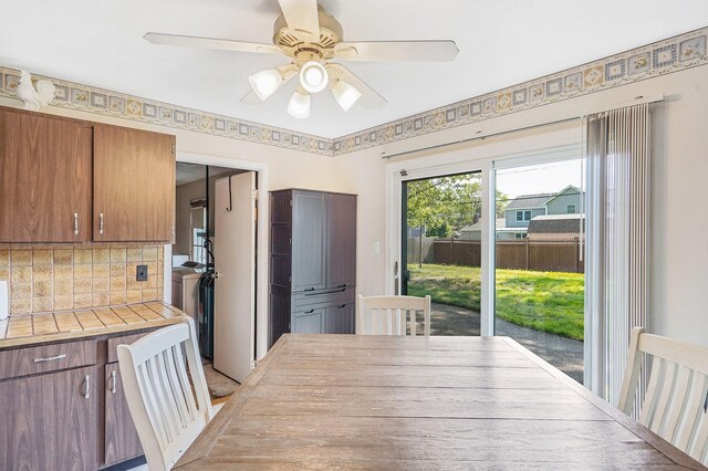 1340 Stony Brook Rd, Stony Brook, NY 11790 - dining room with washer and dryer and a ceiling fan