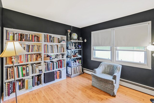 1340 Stony Brook Rd, Stony Brook, NY 11790 - living area with baseboard heating and wood finished floors
