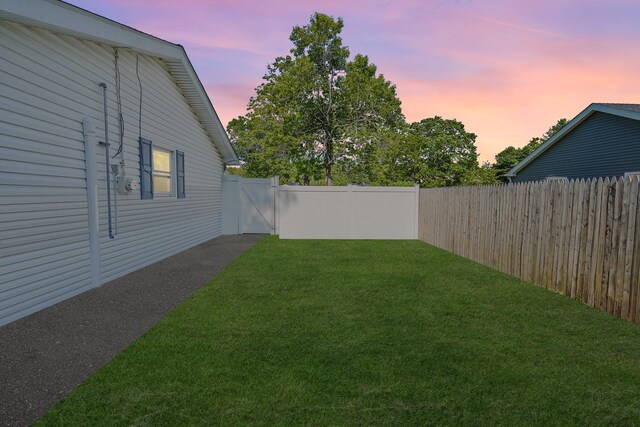 1340 Stony Brook Rd, Stony Brook, NY 11790 - yard at dusk featuring a gate and a fenced backyard