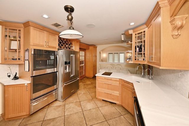 2 Elener Ln, Spring Valley, NY 10977 - kitchen featuring appliances with stainless steel finishes, a warming drawer, light brown cabinets, a sink, and tasteful backsplash