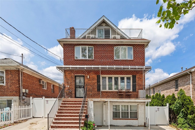628 151st St, Whitestone, NY 11357 - view of front of house with a gate, a balcony, and brick siding
