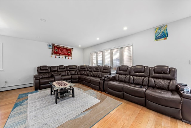 628 151st St, Whitestone, NY 11357 - living area with baseboard heating, light wood finished floors, and recessed lighting