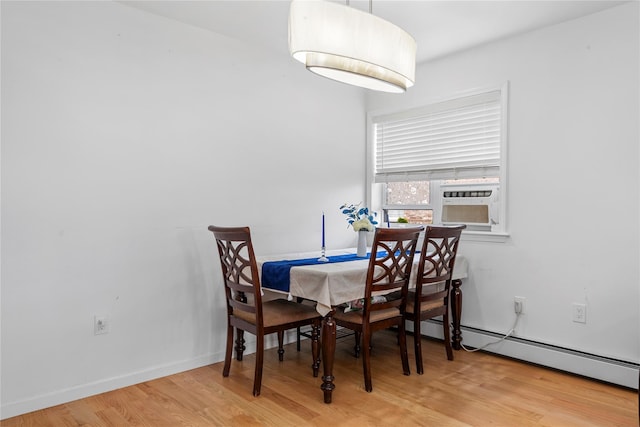 628 151st St, Whitestone, NY 11357 - dining space featuring a baseboard radiator, wood finished floors, cooling unit, and baseboards