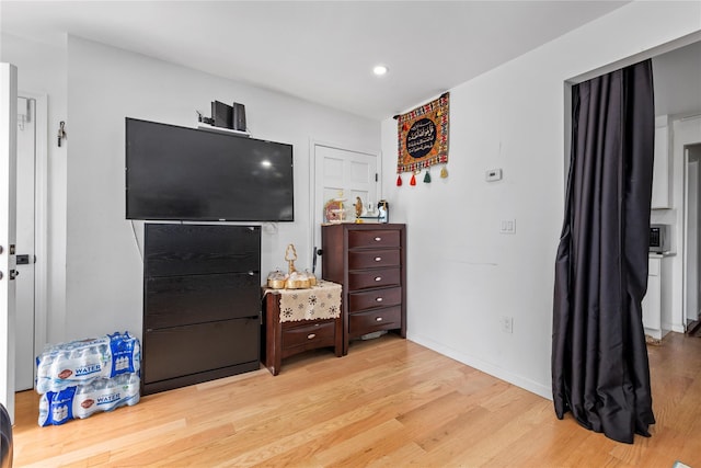 628 151st St, Whitestone, NY 11357 - bedroom featuring light wood-style floors, recessed lighting, and baseboards