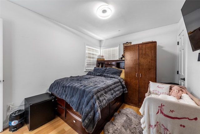628 151st St, Whitestone, NY 11357 - bedroom with light wood-style flooring