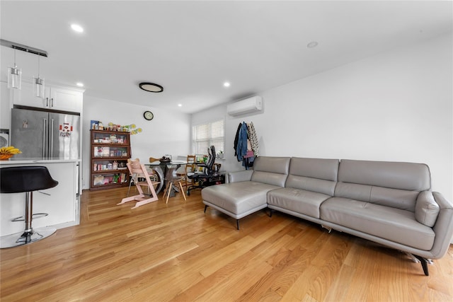 628 151st St, Whitestone, NY 11357 - living room featuring a wall mounted air conditioner, light wood-style flooring, and recessed lighting