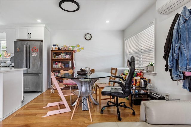 628 151st St, Whitestone, NY 11357 - dining space with a wall mounted AC, light wood-style flooring, and recessed lighting