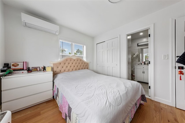 628 151st St, Whitestone, NY 11357 - bedroom featuring a wall mounted AC, light wood-style floors, ensuite bathroom, and a closet