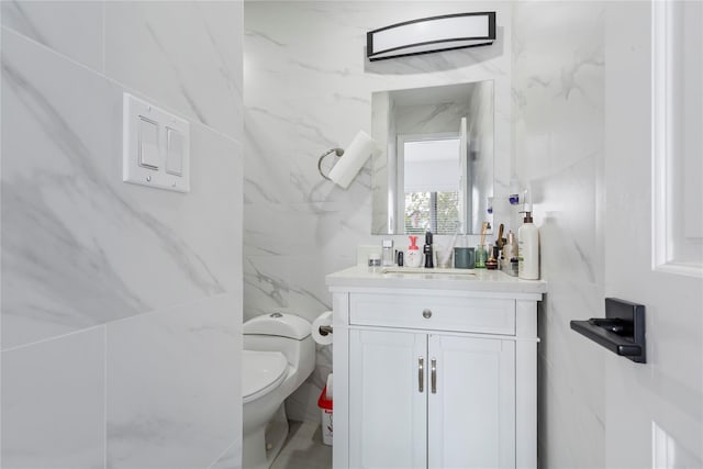 628 151st St, Whitestone, NY 11357 - bathroom with vanity, toilet, and tile walls