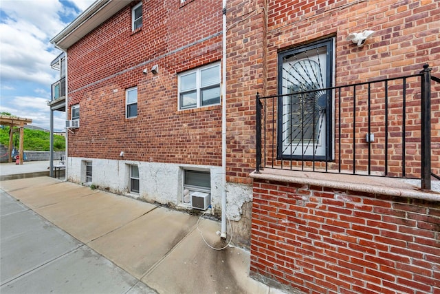 628 151st St, Whitestone, NY 11357 - view of property exterior featuring brick siding and cooling unit