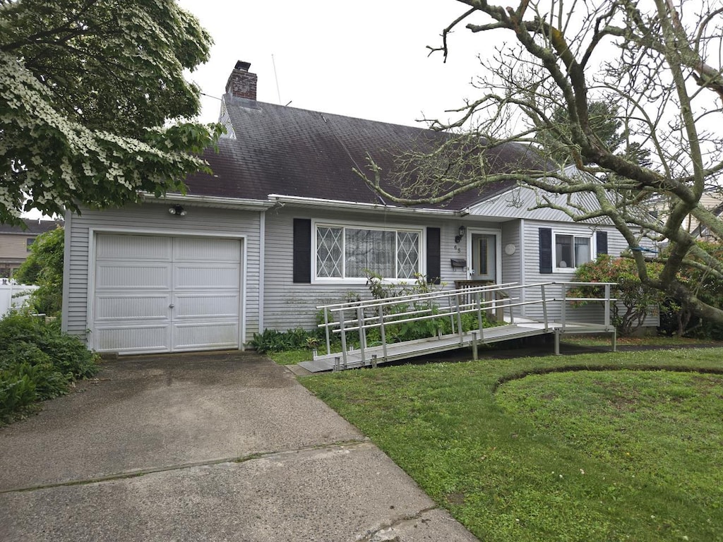65 Birchfield Ave, Babylon, NY 11702 - single story home with a garage, a chimney, driveway, and a front yard