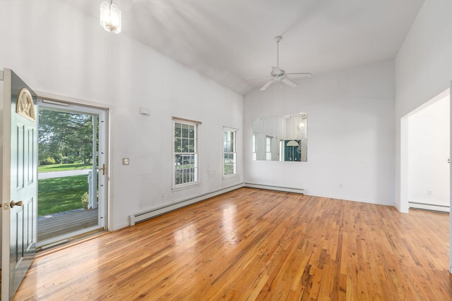 67 Fairway Dr, Wading River, NY 11792 - unfurnished living room featuring plenty of natural light, wood finished floors, a ceiling fan, and high vaulted ceiling