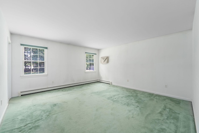 67 Fairway Dr, Wading River, NY 11792 - carpeted spare room featuring a baseboard radiator and baseboards