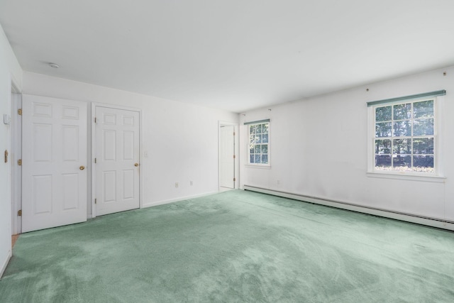 67 Fairway Dr, Wading River, NY 11792 - unfurnished room featuring carpet, a baseboard heating unit, and baseboards