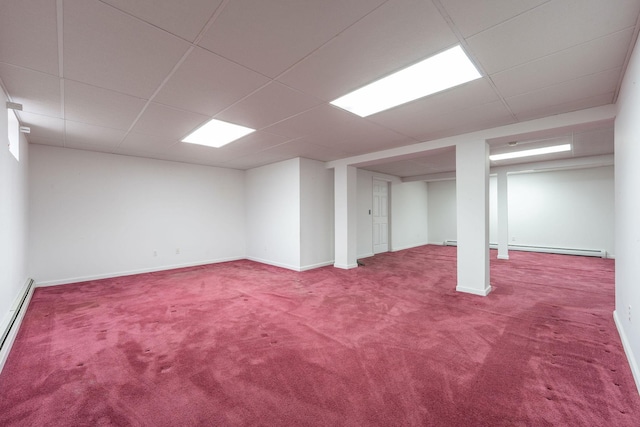 67 Fairway Dr, Wading River, NY 11792 - finished below grade area with carpet flooring, a paneled ceiling, baseboards, and baseboard heating