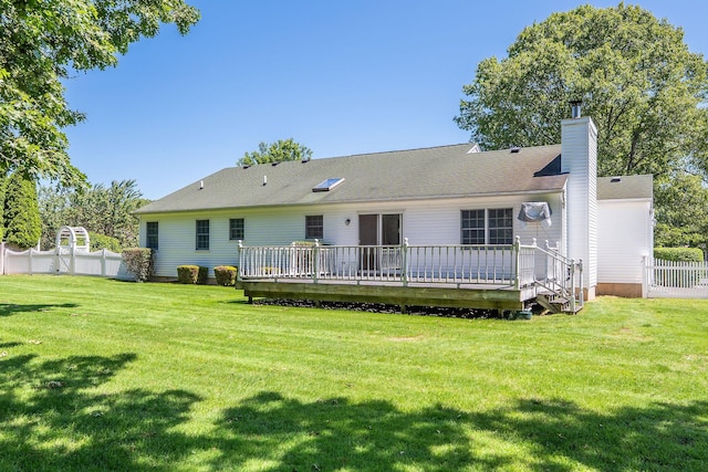 67 Fairway Dr, Wading River, NY 11792 - rear view of property with a wooden deck and a chimney