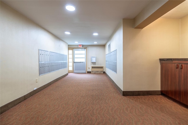 490 Atlantic Ave Unit 103, East Rockaway, NY 11518 - hallway featuring radiator, mail area, recessed lighting, carpet, and baseboards