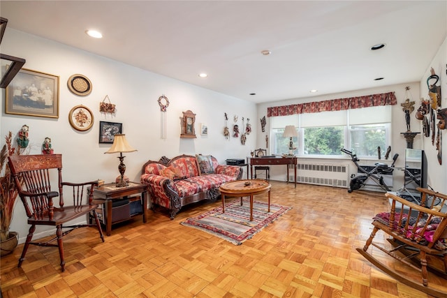 490 Atlantic Ave Unit 103, East Rockaway, NY 11518 - living room featuring radiator and recessed lighting