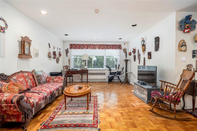490 Atlantic Ave Unit 103, East Rockaway, NY 11518 - living room featuring radiator and recessed lighting