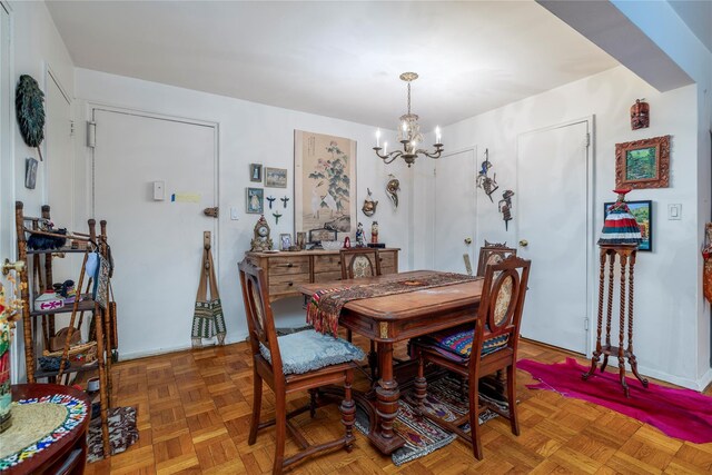 490 Atlantic Ave Unit 103, East Rockaway, NY 11518 - dining room with a chandelier