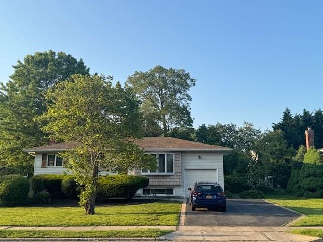 39 Seneca Dr, Commack, NY 11725 - view of front of home with asphalt driveway, a front lawn, and an attached garage