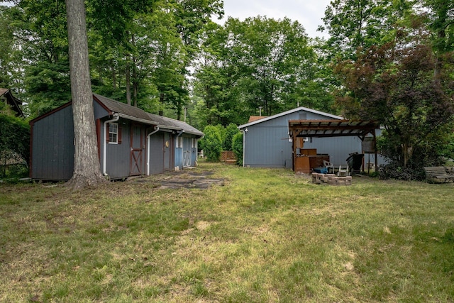 3 Avenue E, Godeffroy, NY 12729 - view of green lawn featuring a pergola, an outbuilding, and view of scattered trees