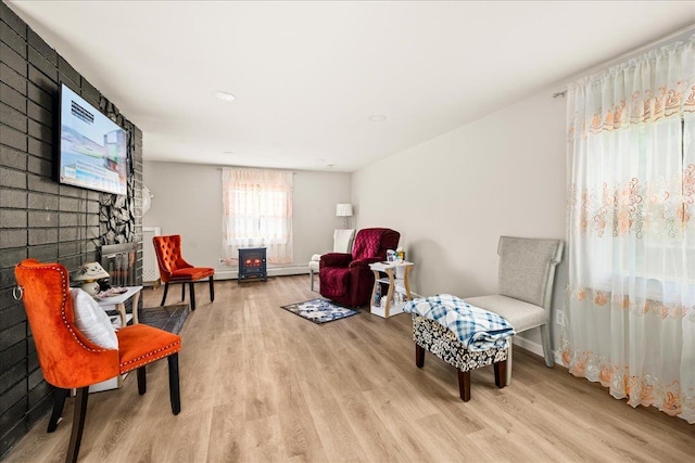 109 Silverleaf Ln, Islandia, NY 11749 - living area featuring light wood-style floors, baseboards, a large fireplace, and recessed lighting