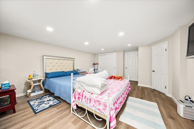 109 Silverleaf Ln, Islandia, NY 11749 - bedroom with wood finished floors, baseboards, and recessed lighting