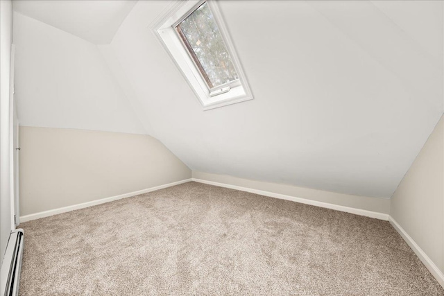 109 Silverleaf Ln, Islandia, NY 11749 - additional living space with a baseboard radiator, carpet flooring, lofted ceiling, a skylight, and baseboards