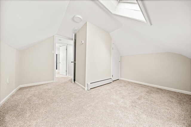 109 Silverleaf Ln, Islandia, NY 11749 - bonus room with a baseboard radiator, carpet floors, lofted ceiling, and baseboards