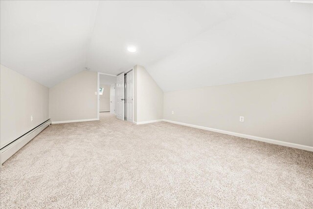 109 Silverleaf Ln, Islandia, NY 11749 - bonus room with baseboard heating, carpet flooring, vaulted ceiling, and baseboards