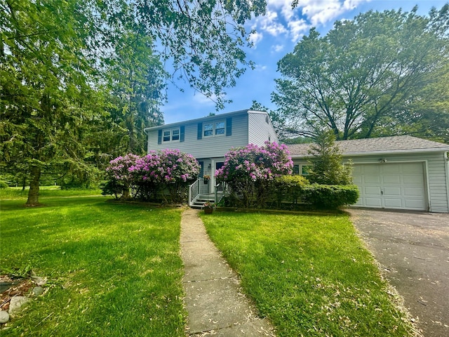 3 Johnston Rd, Livingston Manor, NY 12758 - view of front facade with asphalt driveway, an attached garage, and a front lawn