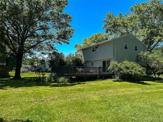 3 Johnston Rd, Livingston Manor, NY 12758 - rear view of property featuring a lawn and a wooden deck