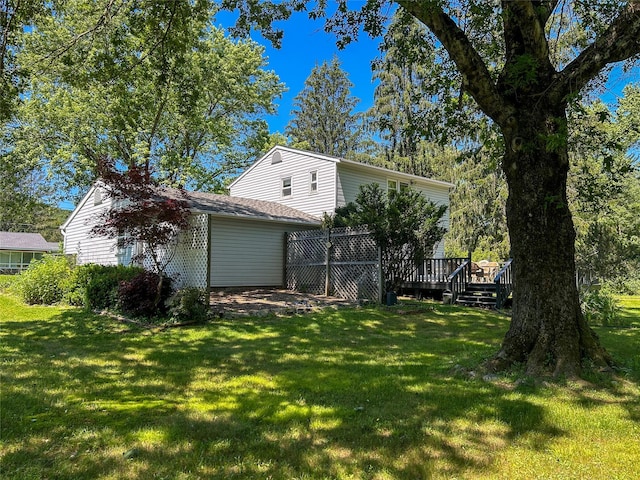 3 Johnston Rd, Livingston Manor, NY 12758 - view of front of house featuring a wooden deck, a front lawn, and an attached garage