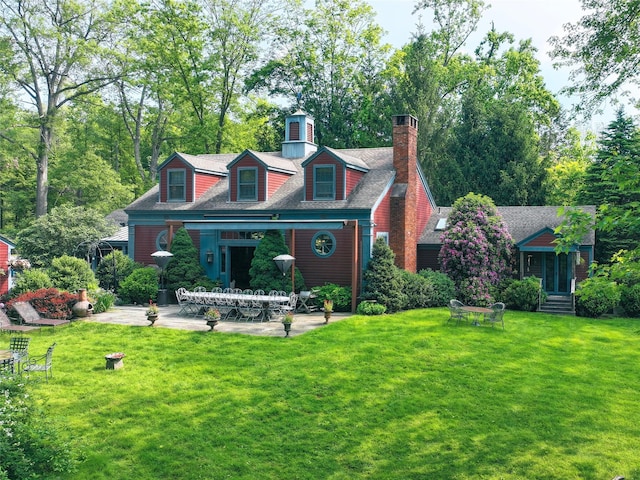501 Guard Hill Rd, Bedford, NY 10506 - back of property with a yard, a patio, a chimney, and roof with shingles