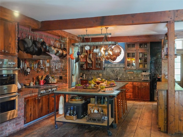 501 Guard Hill Rd, Bedford, NY 10506 - bar area with stainless steel appliances, wood-type flooring, beamed ceiling, decorative backsplash, and a sink