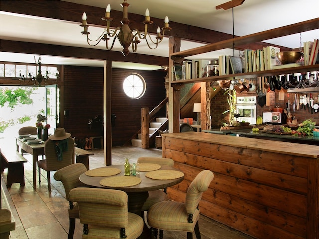 501 Guard Hill Rd, Bedford, NY 10506 - dining space with a chandelier, stairway, and light wood finished floors