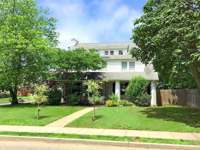 876 Woodmere Pl, Woodmere, NY 11598 - view of front facade with a chimney and a shingled roof