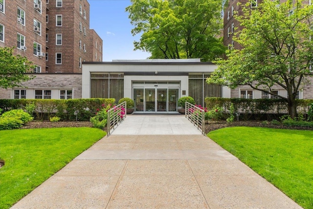 112-20 72nd Dr Unit A33, Forest Hills, NY 11375 - view of building exterior featuring concrete driveway