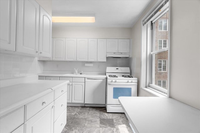 112-20 72nd Dr Unit A33, Forest Hills, NY 11375 - kitchen with white appliances, under cabinet range hood, white cabinetry, a sink, and light countertops