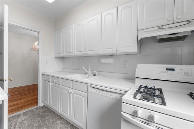 112-20 72nd Dr Unit A33, Forest Hills, NY 11375 - kitchen featuring white appliances, under cabinet range hood, a sink, white cabinets, and backsplash