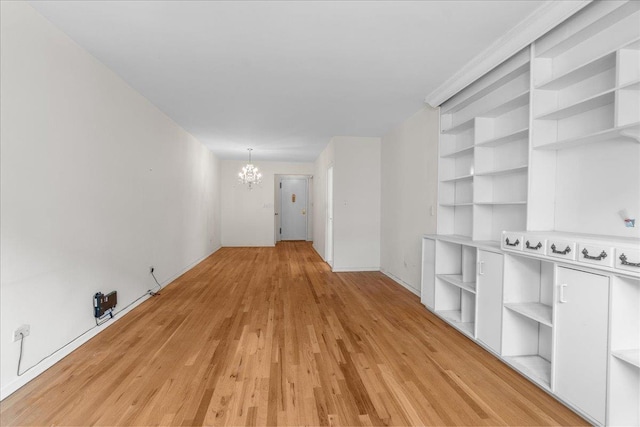 112-20 72nd Dr Unit A33, Forest Hills, NY 11375 - unfurnished room featuring a chandelier and light wood finished floors
