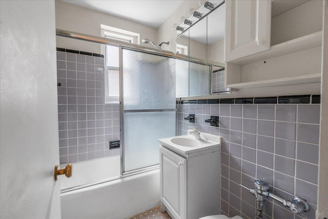 112-20 72nd Dr Unit A33, Forest Hills, NY 11375 - bathroom featuring vanity, combined bath / shower with glass door, and tile walls