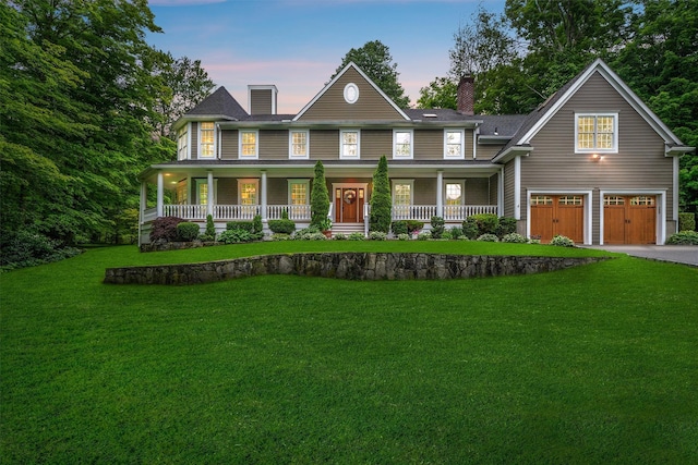 383 Illington Rd, Ossining, NY 10562 - view of front of house featuring a chimney, covered porch, a garage, driveway, and a front yard