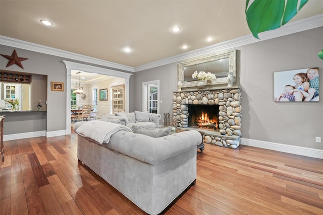 383 Illington Rd, Ossining, NY 10562 - living area featuring crown molding, a fireplace, wood-type flooring, a chandelier, and recessed lighting