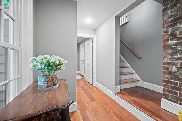 383 Illington Rd, Ossining, NY 10562 - hall with wood finished floors, stairway, and recessed lighting