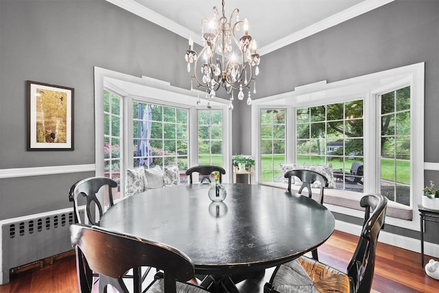383 Illington Rd, Ossining, NY 10562 - dining area with a chandelier, crown molding, radiator, and wood finished floors