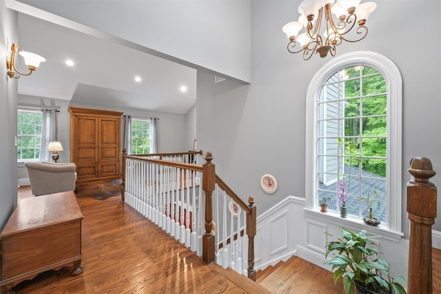 383 Illington Rd, Ossining, NY 10562 - entryway with a chandelier, wood finished floors, wainscoting, vaulted ceiling, and recessed lighting