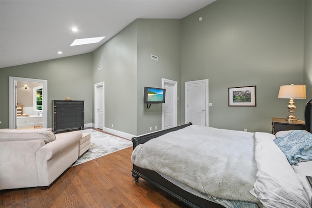 383 Illington Rd, Ossining, NY 10562 - bedroom with a skylight, high vaulted ceiling, wood finished floors, recessed lighting, and ensuite bathroom